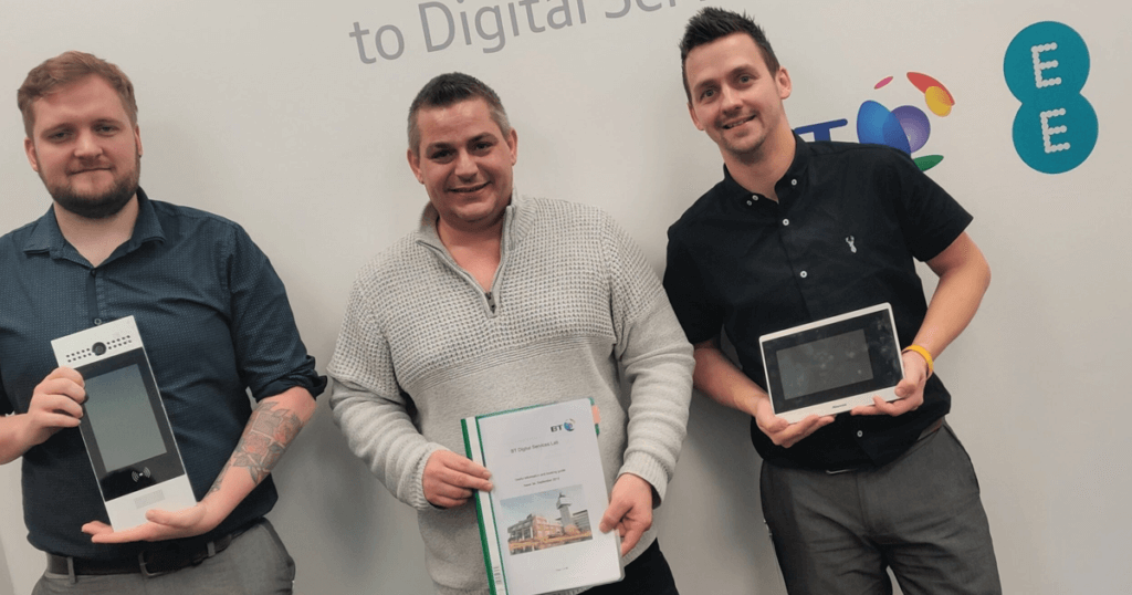 Appello colleagues holding Appello digital telecare units