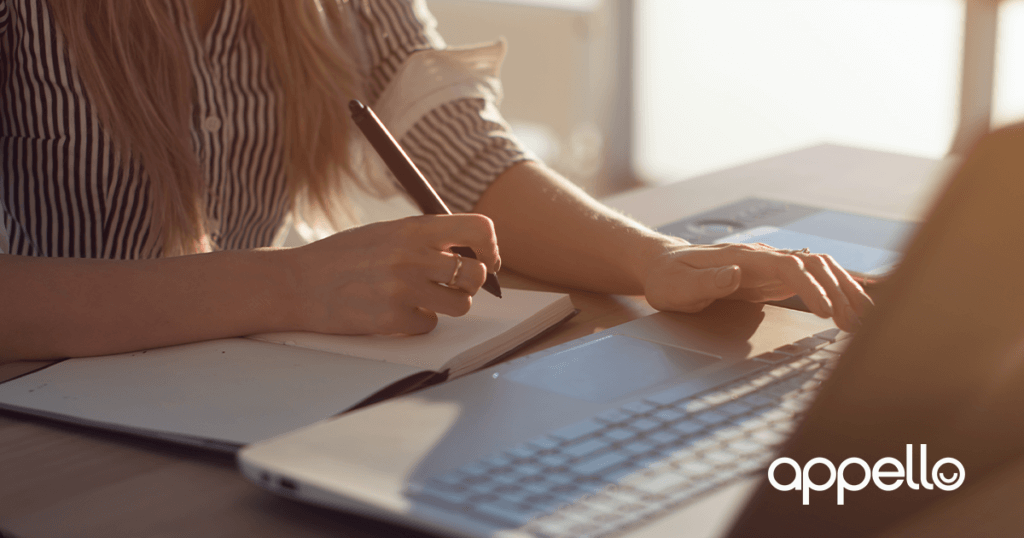 female typing on the computer - utilising digital telecare devices