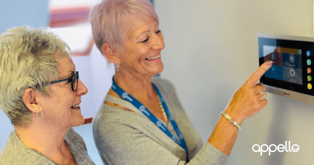 Two people looking at Smart Living Solutions LivingHub