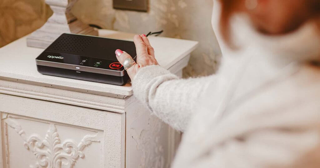 Woman pressing SmartLife button
